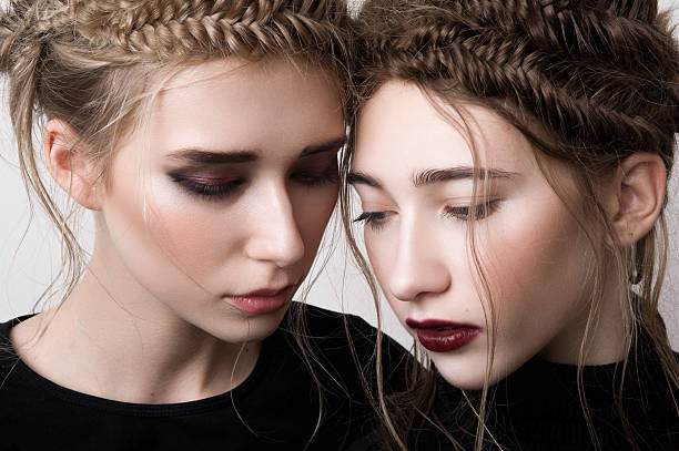 istock Closeup portrait of two beauty models with braids 529083575