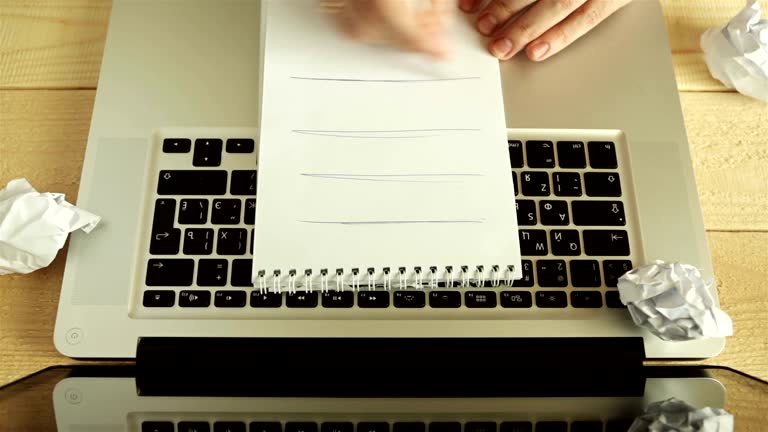 Man freelancer male hands with pen writing on notebook at home or office