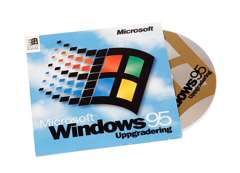Stockholm, Sweden - December 15, 2014:  Microsoft Windows 95 operating system cover with CD for the Swedish version, isolated on white background.