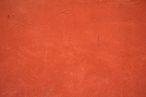 istock Texture of old wall covered with red stucco 529095997