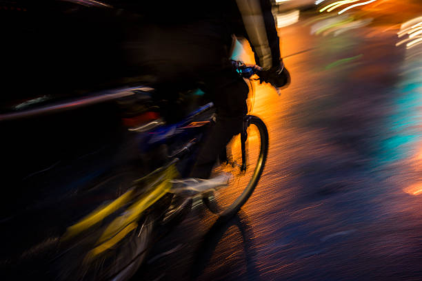 istock Man cycling in the night 529096179