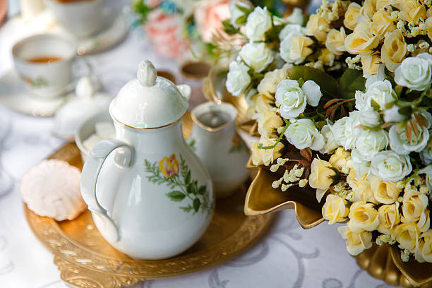 istock Flowers, tea, marshmallows on a tray on the table 529099633