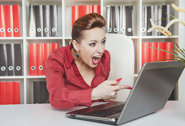 istock Angry screaming business woman working with computer 529100207