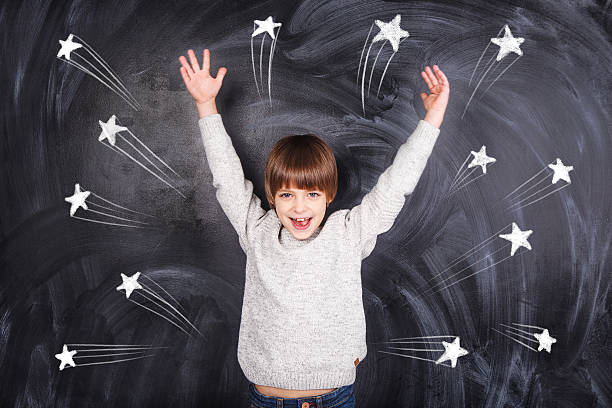 istock The boy raised his hands to the top 529100493