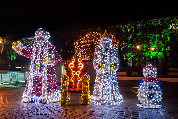 istock Santa Claus and Snow White statues brightly lit 529100645