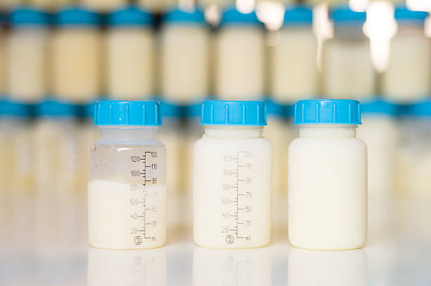 Stock - Frozen mother milk in bottles stock photo