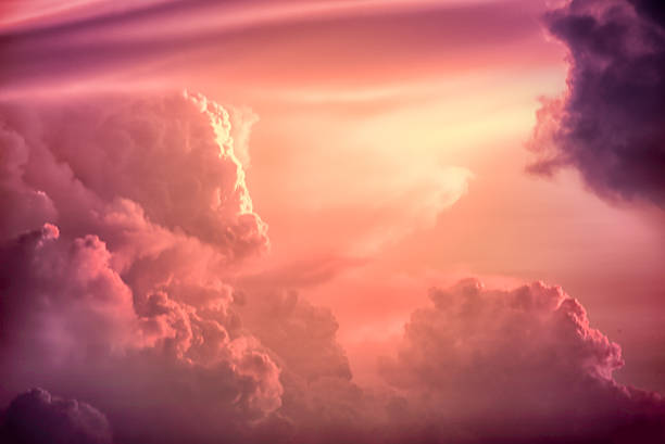 Color toned image,Dramatic sunset sky with colorful clouds. Colorful clouds on the dramatic sunset sky, Color toned image,Dramatic sunset sky with colorful clouds. california fuchsia stock pictures, royalty-free photos & images