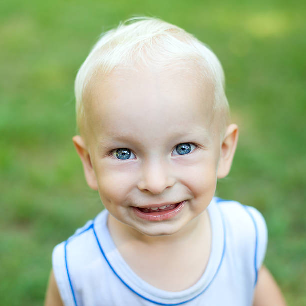 istock smiling little boy in the park 529114689
