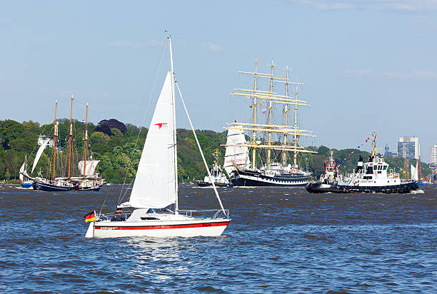 Russian tall ship Kruzenstern at Hamburg Hamburg, Germany - May 8, 2016: Participants in departure parade of 827th Hamburg Port Anniversary, among them Russian four-masted tall ship Kruzenstern. Small sail boat with spectators in foreground. krusenstern stock pictures, royalty-free photos & images