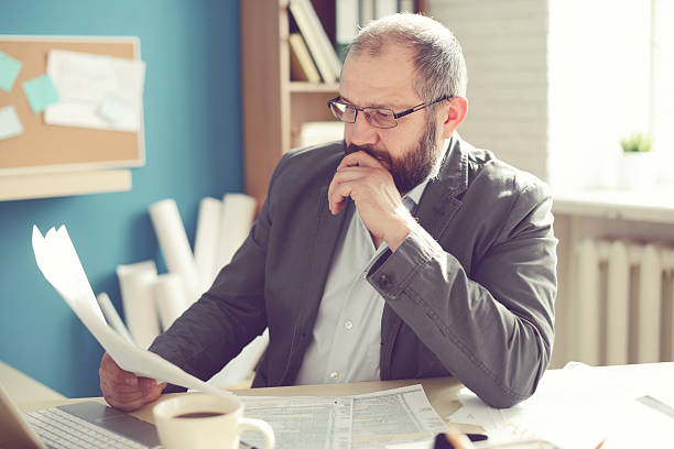 istock Mature Adult man working in the office 529115648