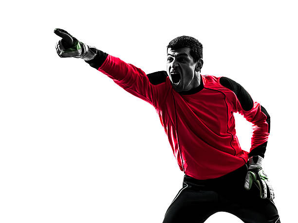 istock caucasian soccer player goalkeeper man pointing silhouette 529116561