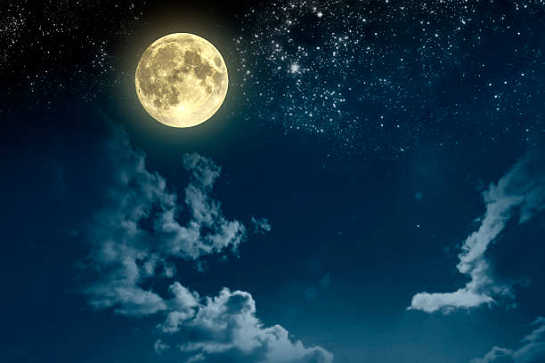 istock Beautiful magic blue night sky with clouds, fullmoon, stars 529116774