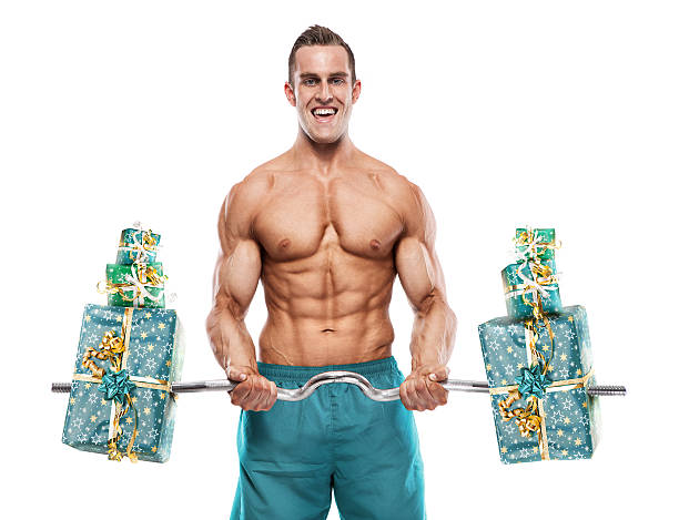 Muscular Bodybuilder Guy Doing Exercises With Gifts Stock Photo - Download  Image Now - iStock