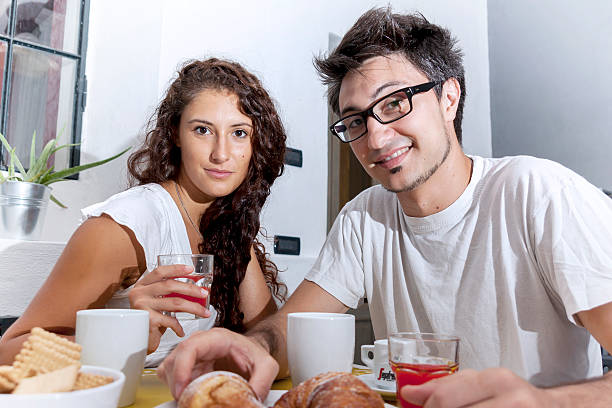 istock teenage couple has breakfast at home 529120068