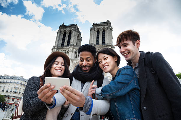 istock interacial group young friends take selfie at Notre Dame Paris 529124746