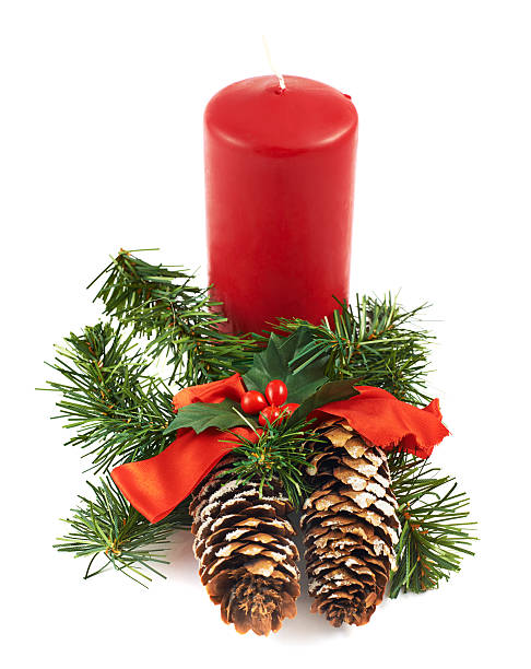 istock Candle and fir-tree branch composition 529128052