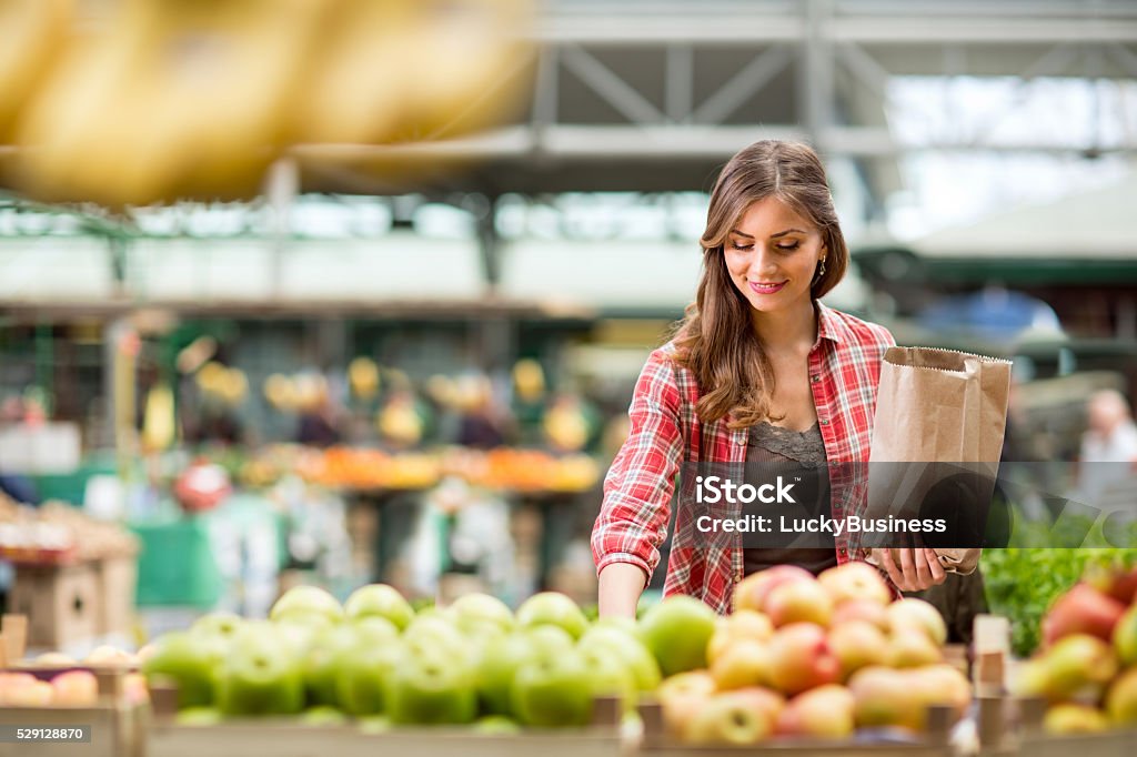 shopping woman buying at the market shopping woman buying fruit at the market Supermarket Stock Photo