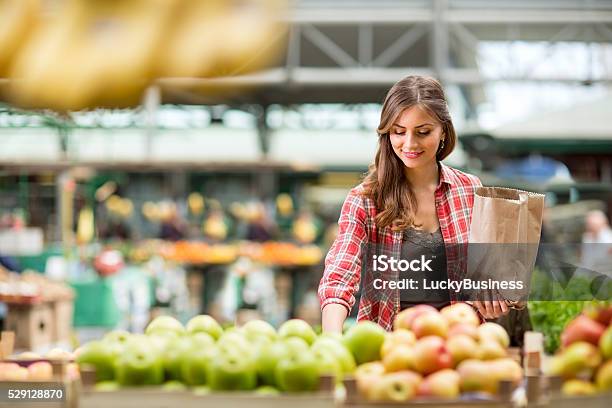 Shopping Woman Buying At The Market Stock Photo - Download Image Now - Supermarket, Shopping, Retail