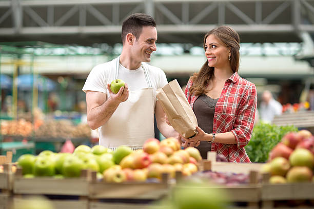 istock smile salesman presentation at the market 529129078