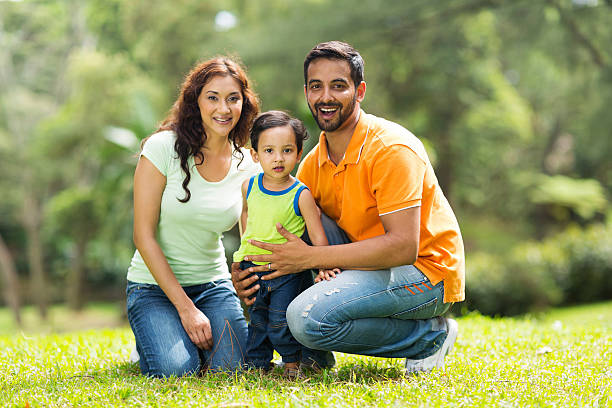 happy indian family outdoors portrait of happy indian family outdoors happy indian young family couple stock pictures, royalty-free photos & images