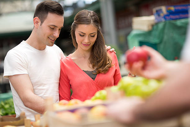 istock Couple choosing apples in grocery store 529131282