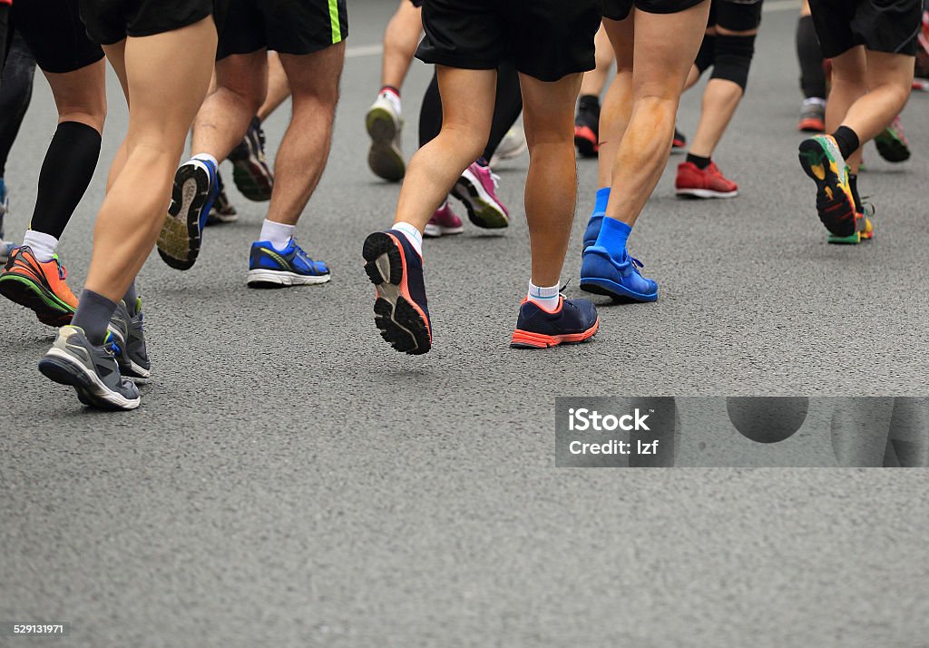 marathon runner legs marathon runners on the street Marathon Stock Photo