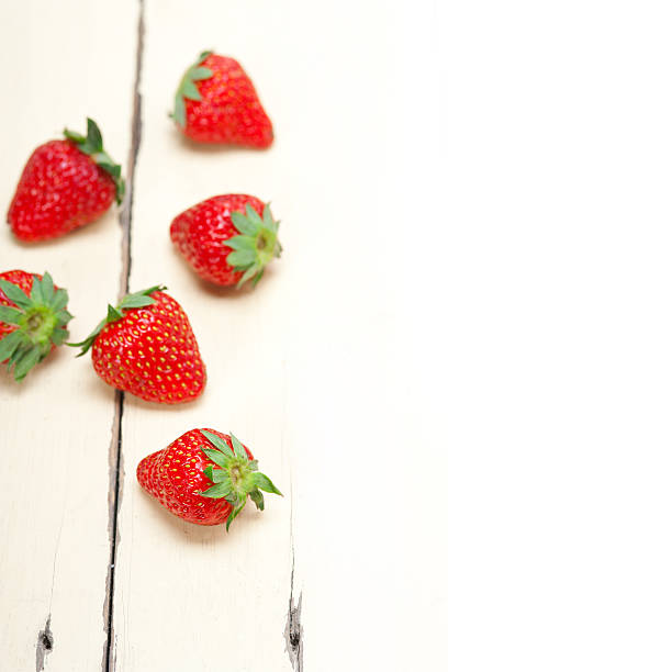 istock fresh organic strawberry over white wood 529132285