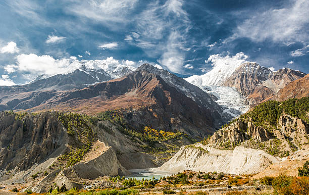 istock Picturesque mountain panorama. Glacier river flowing though a valley. 529132436