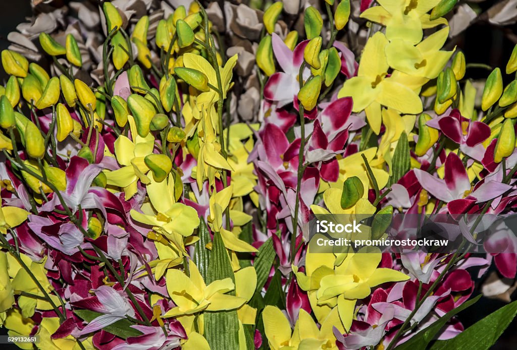 Fake yellow flowers Fake yellow flowers on sale. Artificial Stock Photo