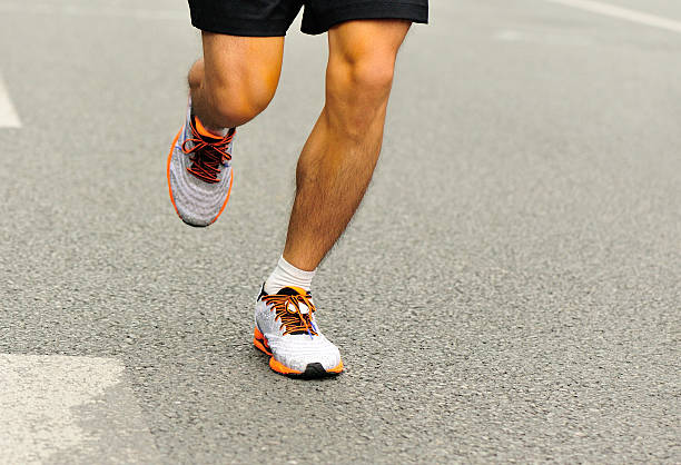 istock marathon runner athlete  running on city road 529134145