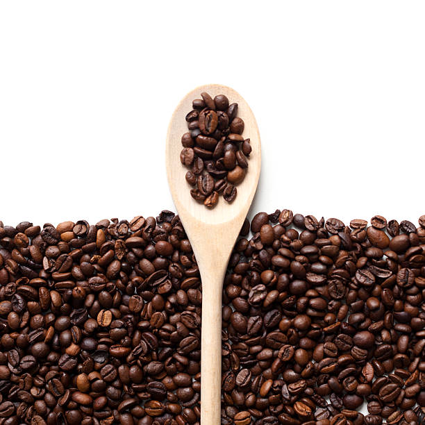 istock Coffee beans frame with wooden spoon 529134426