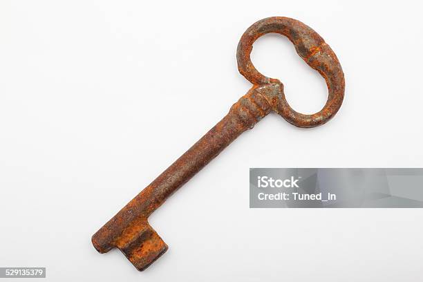 Rusty Old Key On White Background Close Up Stock Photo - Download Image Now - Activity, Aging Process, Damaged