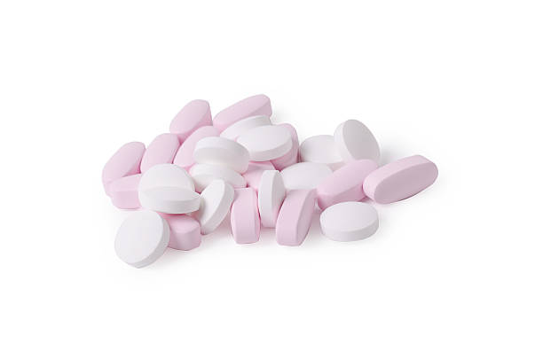istock White and pink probiotic pills or vitamins isolated on a 529135496