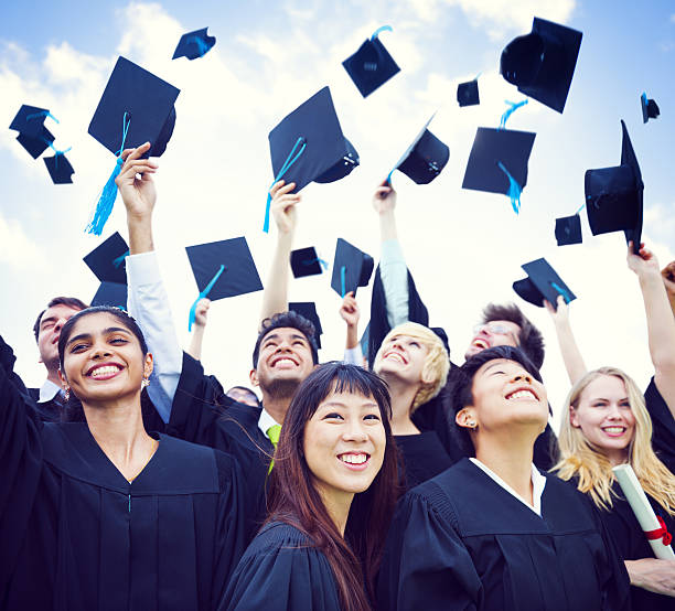 istock Graduation Caps Thrown in the Air 529135531