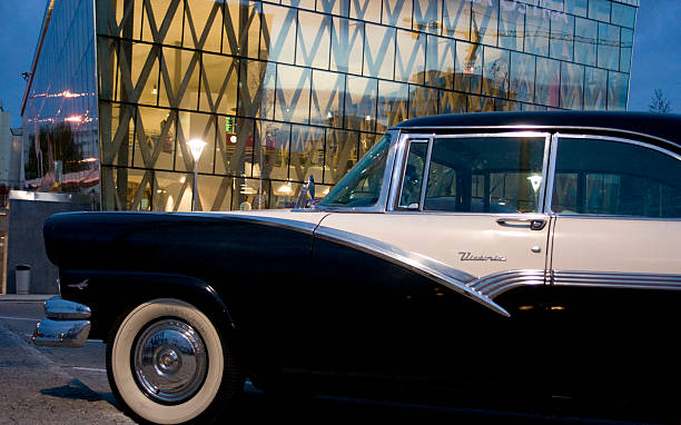istock Old car new building 529135971