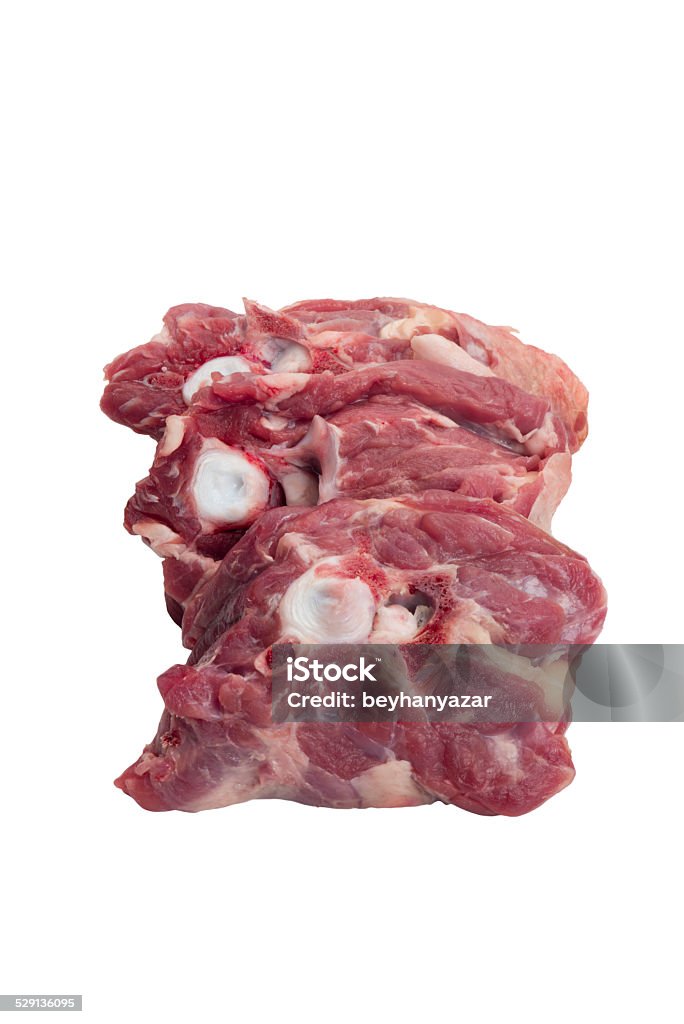 raw uncooked beef tail close up of raw uncooked beef oxtail isolated on white Animal Bone Stock Photo