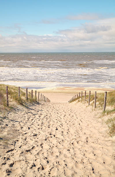 istock sand path to North sea 529136602