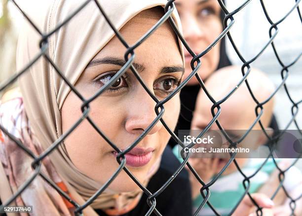 Sad Refugee Middle Eastern Women Stock Photo - Download Image Now - Refugee, Syria, Refugee Camp
