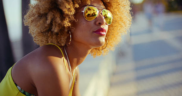 istock Sensual Girl with Afro Resting on Promenade 529139490