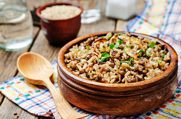 Lentils and rice with Crispy Onions and Parsley Lentils and rice with Crispy Onions and Parsley. Mujadara. toning. selective focus pilau rice stock pictures, royalty-free photos & images