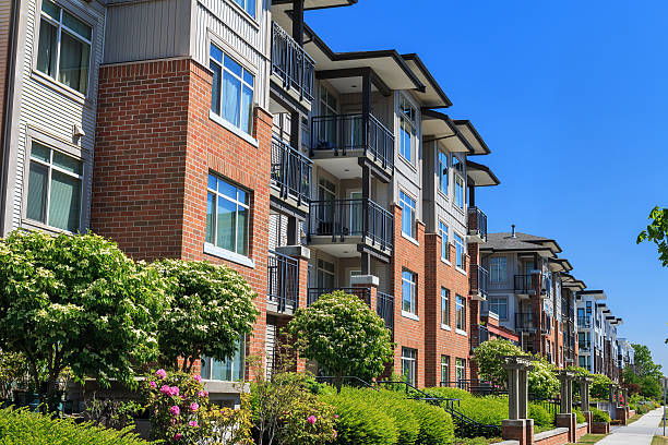 Apartment Buildings Modern apartment buildings in Richmond, British Columbia, Canada. townhouse photos stock pictures, royalty-free photos & images