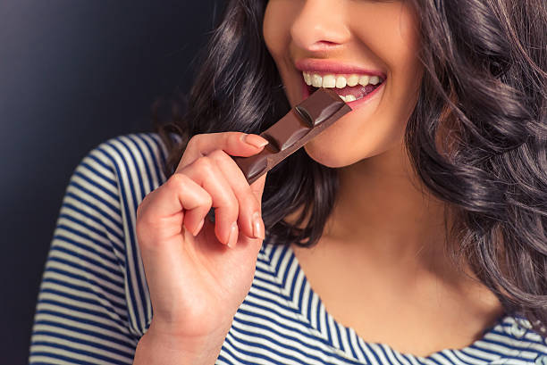 Young woman with chocolate stock photo