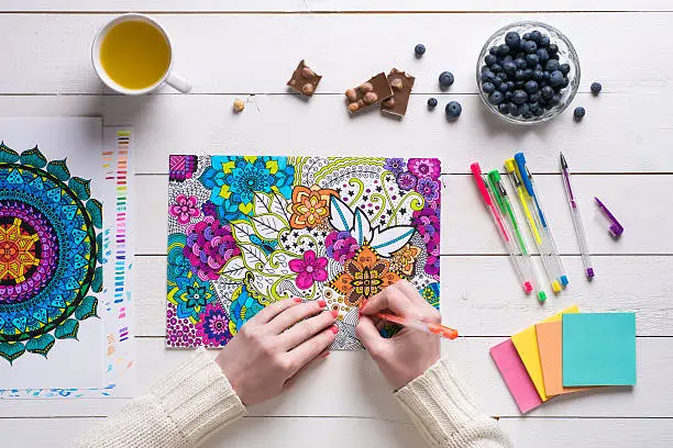 Photo of Female coloring adult coloring books, new stress relieving trend