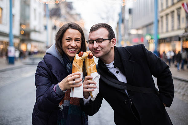 istock Funny couple eating hot dog 529142794