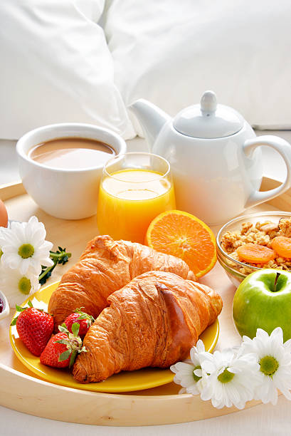 istock Breakfast tray in bed in hotel room 529143316
