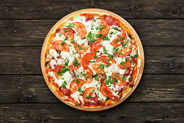 istock Delicious pizza with mushrooms and meat 529144306