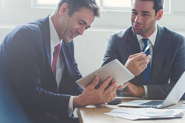 istock Businessmen working together on a digital tablet. 529144560