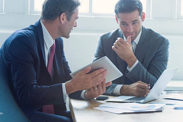 istock Businessmen working together on a digital tablet. 529144614