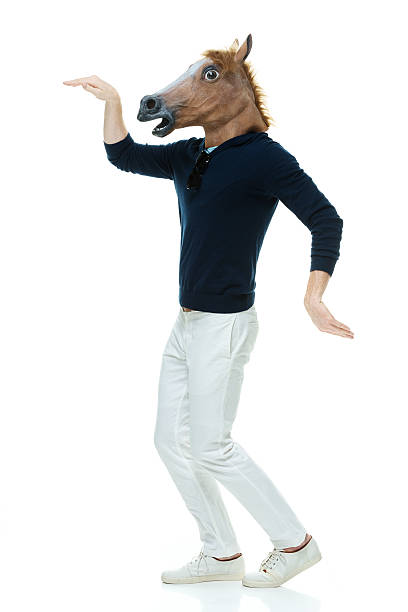 istock Casual man in horse costume & being silly 529159559