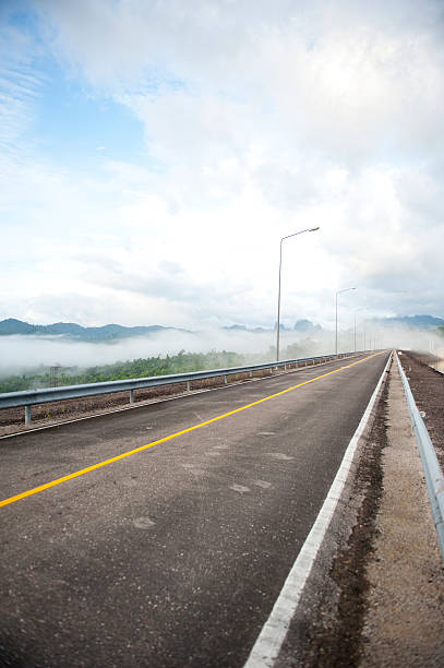 istock empty street in the fog 529162061